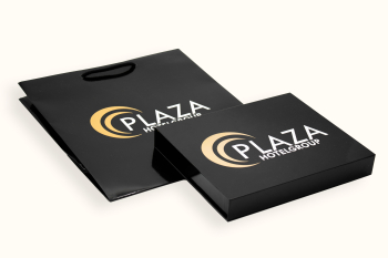 Black gift box and paper bag with Plaza Hotelgroup logo