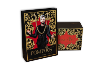 Black gift box and paper bag with golden embellishments and red detail
