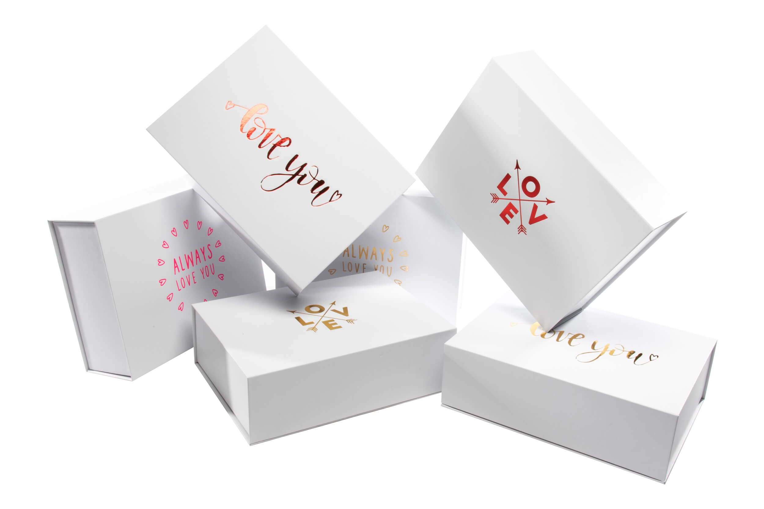 White gift boxes adorned with romantic gold lettering