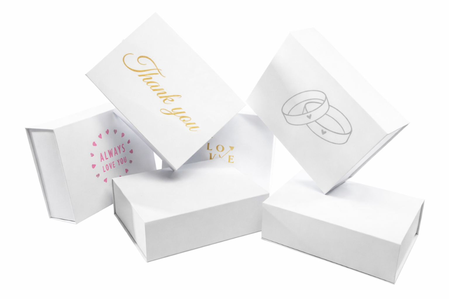 White gift boxes adorned with wedding motifs and thank you messages